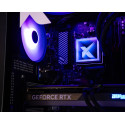 Close-up of blue-lit PC interior showing CPU fan, motherboard, and GeForce RTX graphics card